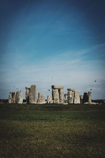 Stonehenge on land against the sky