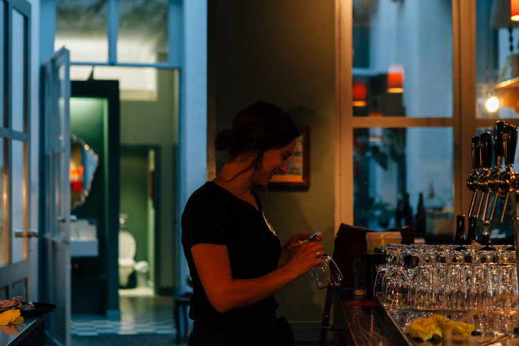 Waitress working in restaurant at night