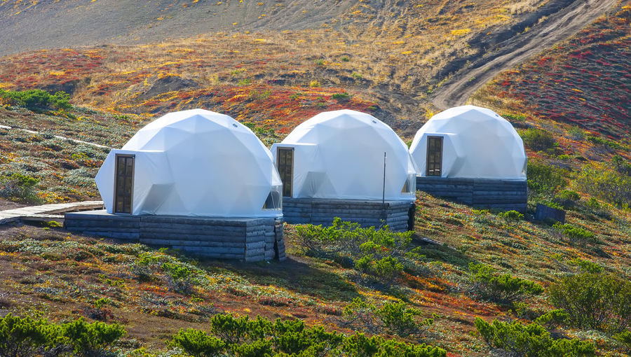 White glamping on the slope of a volcano in autumn on the kamchatka peninsula