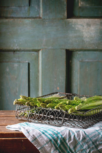 Close-up of asparagus in wire basket