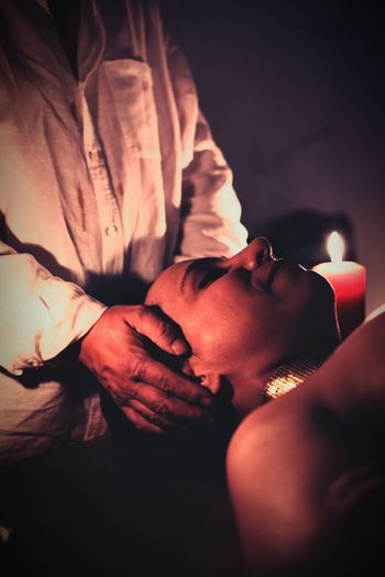 Midsection of woman massaging customer lying on table