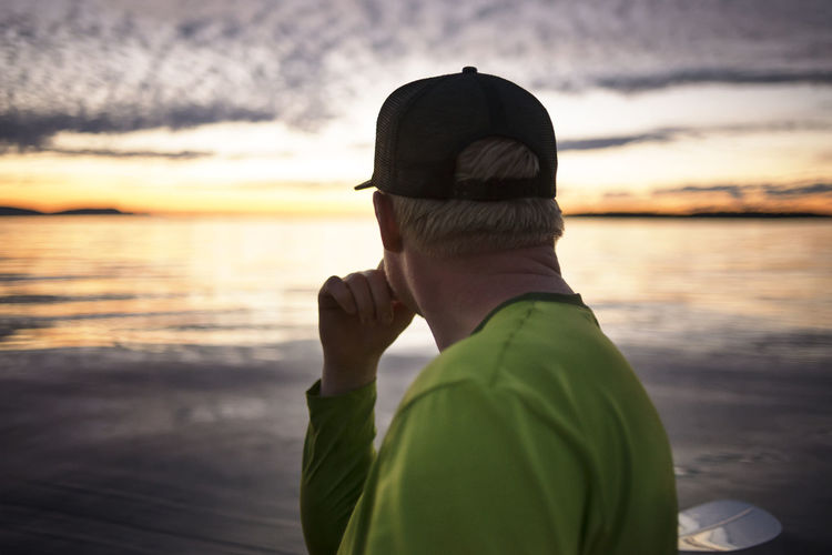Side view of thoughtful man at sucia island during sunset