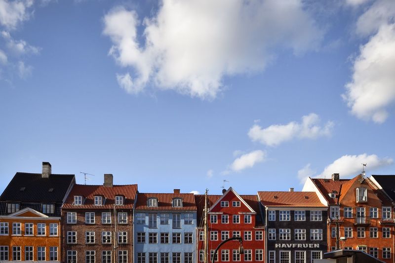 Low angle view of building against cloudy sky