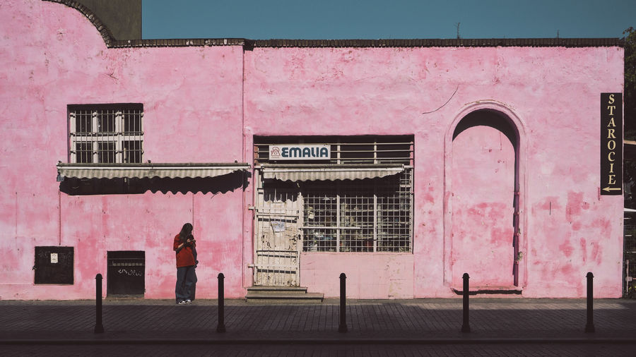 Building with pink umbrella on wall