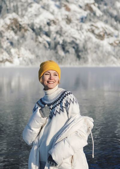 Portrait of young woman skiing in lake