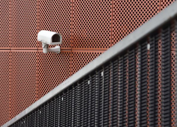 Close-up of security camera on metallic building