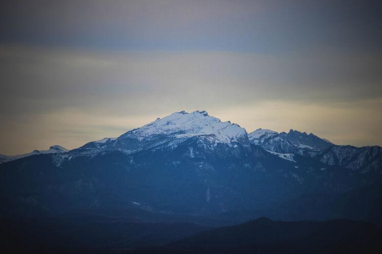 Scenic view of snowcapped mountains against sky