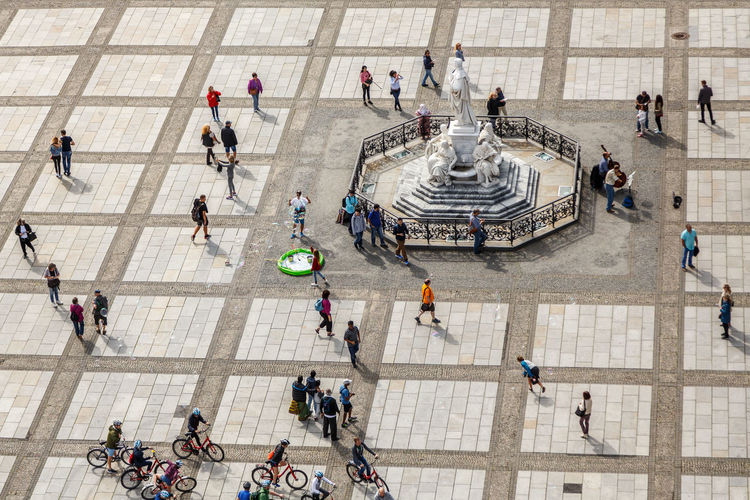 High angle view of people walking in city