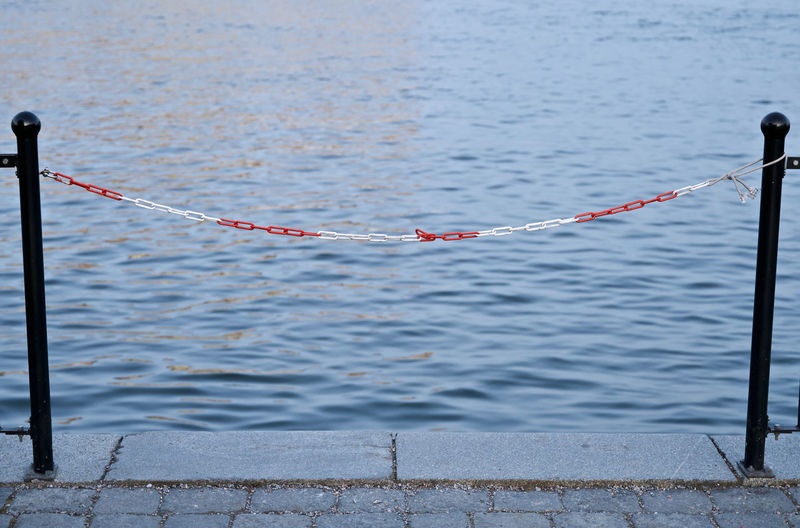 Close-up of rope tied floating on water