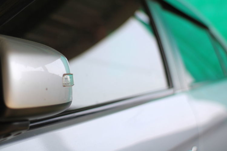Close-up of car side mirror.