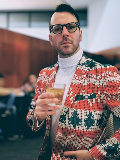 Portrait of fashionable man drinking whiskey