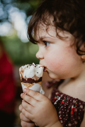 Close-up of child holding ice cream