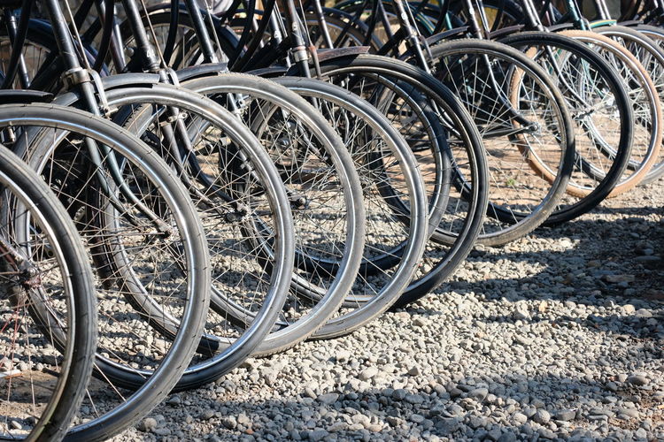 Close-up of bicycle wheel on railroad track