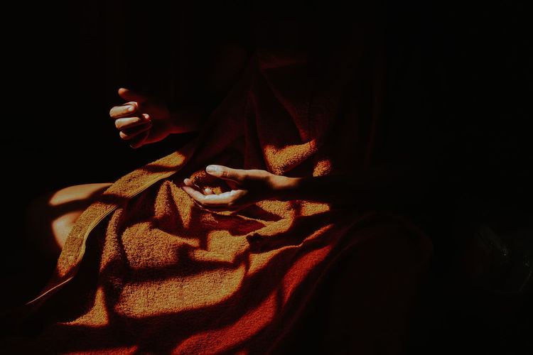 Close up of a woman's hands in the light and shadows