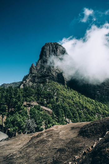 Scenic view of mountains against clear blue sky