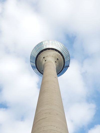 Low angle view of berlin tower against cloudy sky