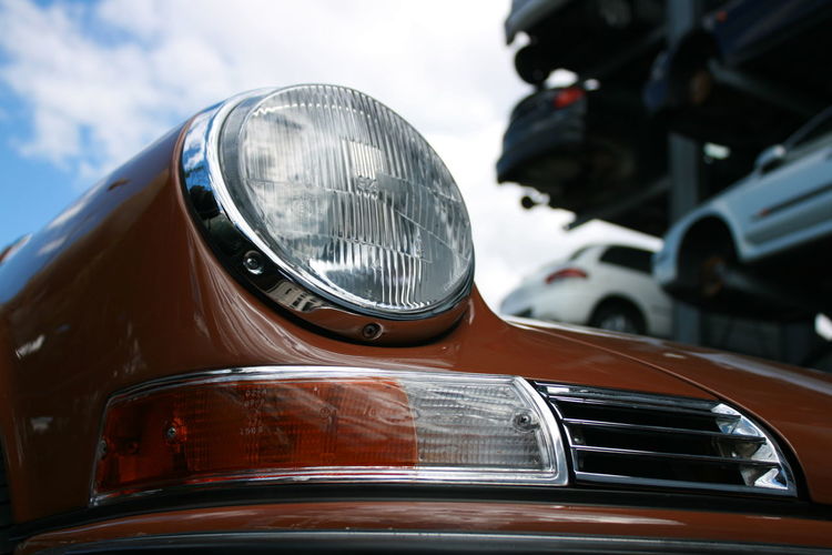 Close-up of headlight on vintage car