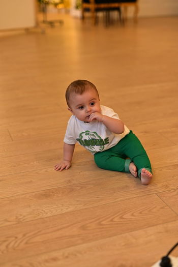 Full length of boy playing with toy on floor