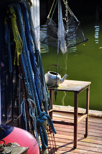 Fishing net on wooden post in lake