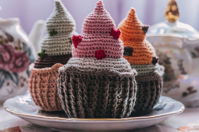 Close-up of crochet cupcakes in plate