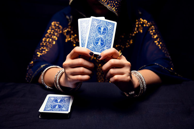 Fortune teller's hands and tarot cards.