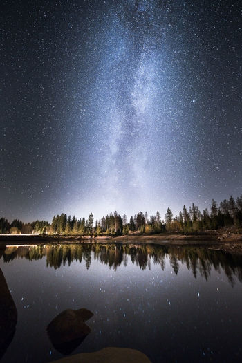 Scenic view of lake against star field