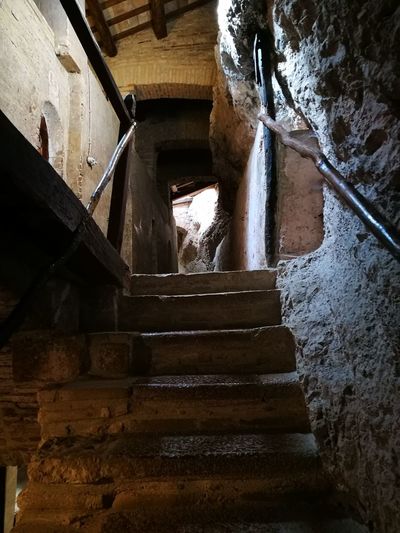 Low angle view of stairs in abandoned building