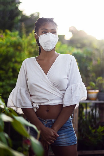 Young black woman in face mask