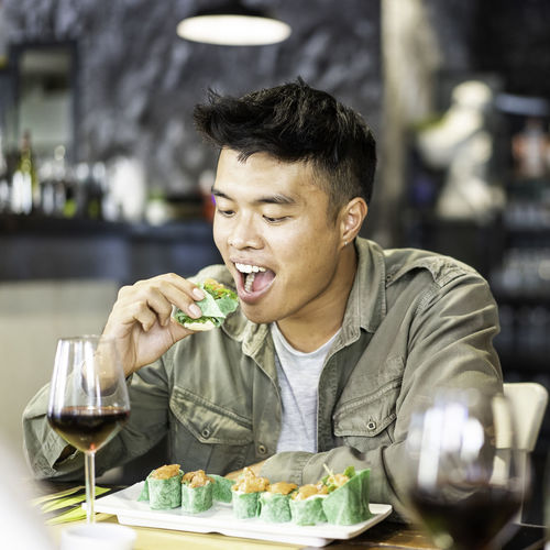Man eating food in restaurant