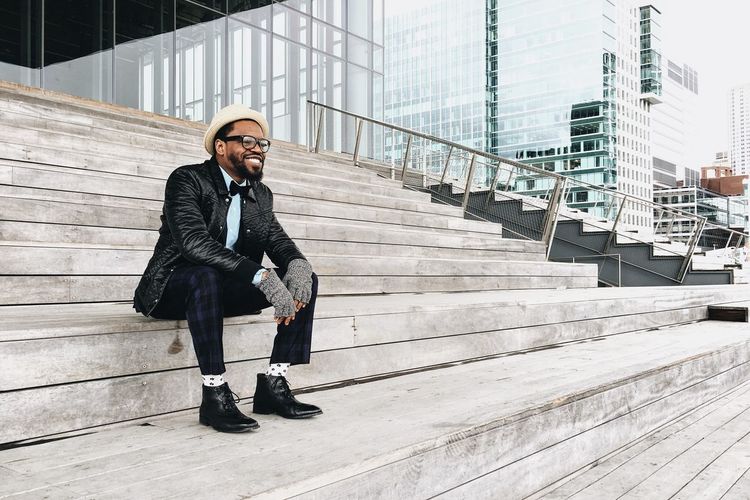 Full length of man sitting on steps
