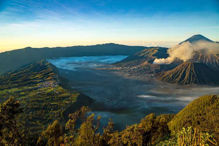 Scenic view of volcanic mountains against sky