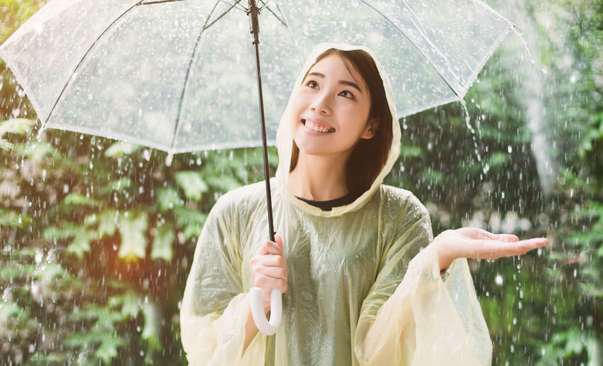 Portrait of a serious young woman in rain