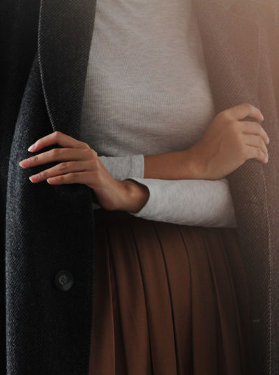 Midsection of woman in warm clothing