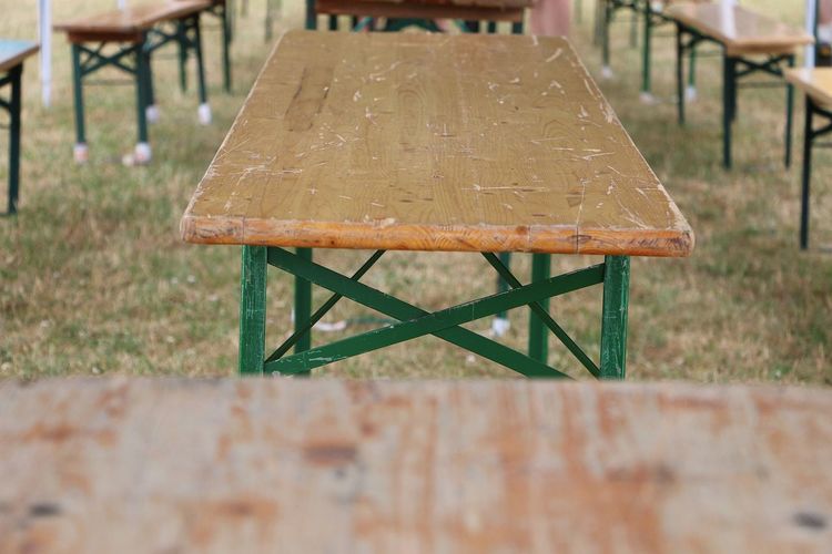 Close-up of empty bench on table