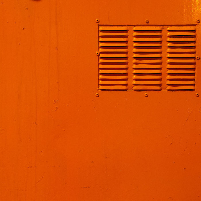 Full frame shot of orange metal locker