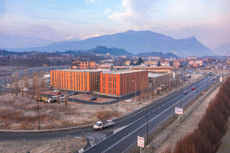 View with an industrial area with a highway in turin by the mountains