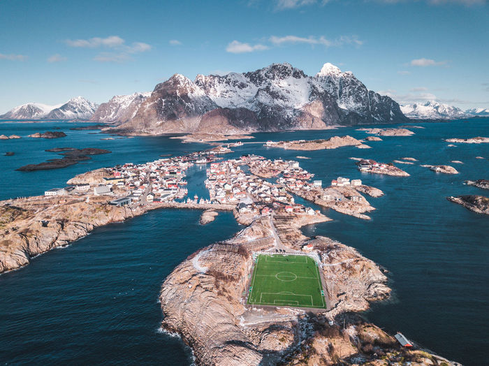 Scenic view of sea and mountains against sky
