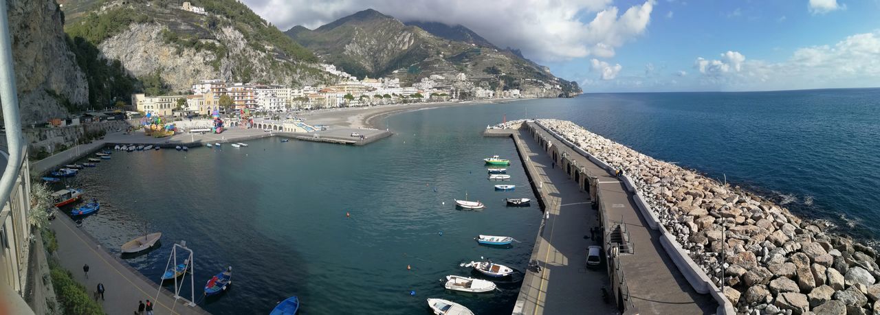 High angle view of harbor by sea against sky