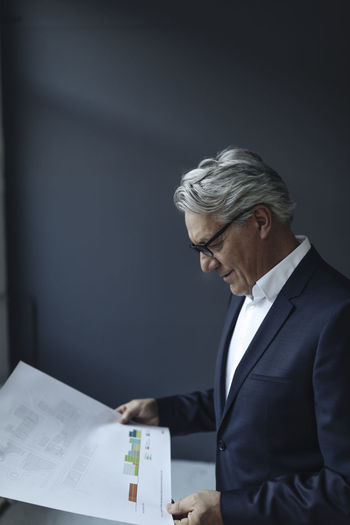 Side view of businessman working at office