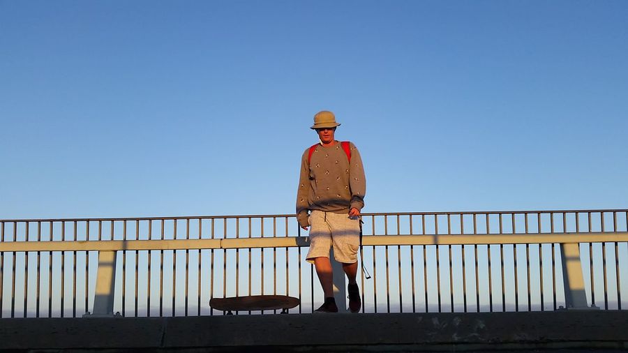 Man standing by railing