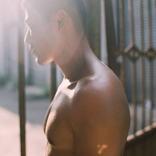Close-up of shirtless young man