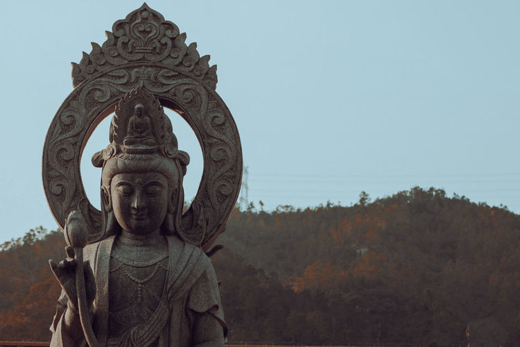 Statue of buddha against clear sky
