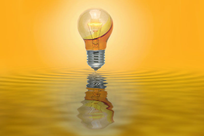 Digital composite image of yellow water against orange sky