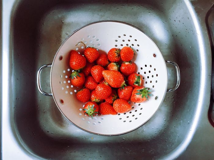 Fresh strawberries in strainer