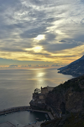 Sunset over the sea of amalfi coast in town of maiori. 
