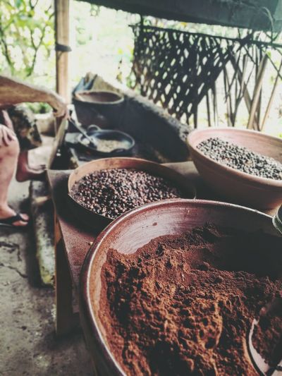 Cropped image of man roasting coffee beans