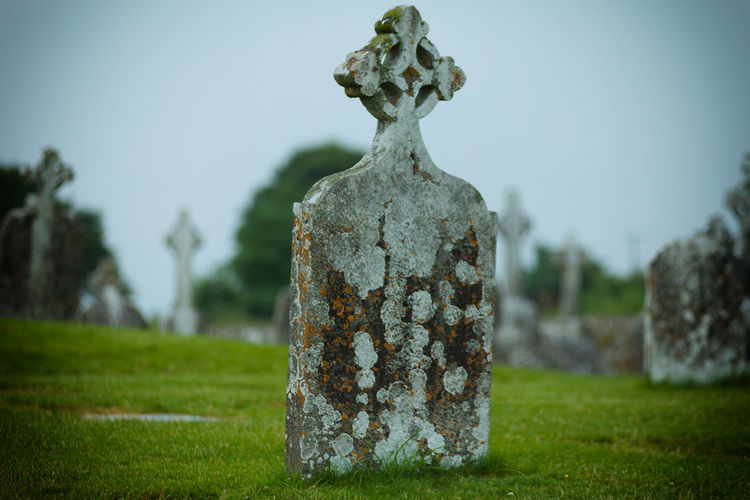 Close-up of cross in cemetery