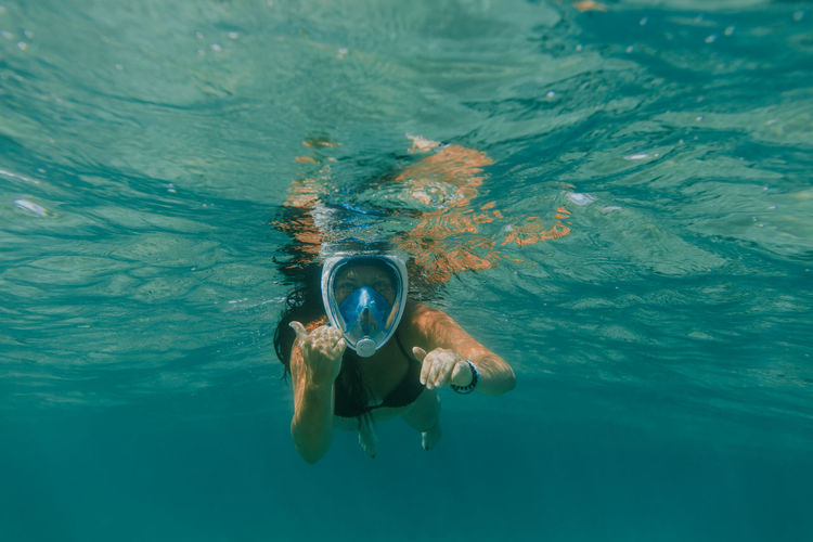 Portrait of woman snorkeling undersea