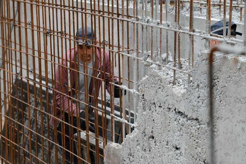 Construction of a concrete wall with reinforcement. private house building by construction company