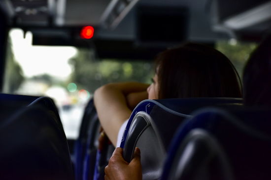 Rear view of women sitting in bus